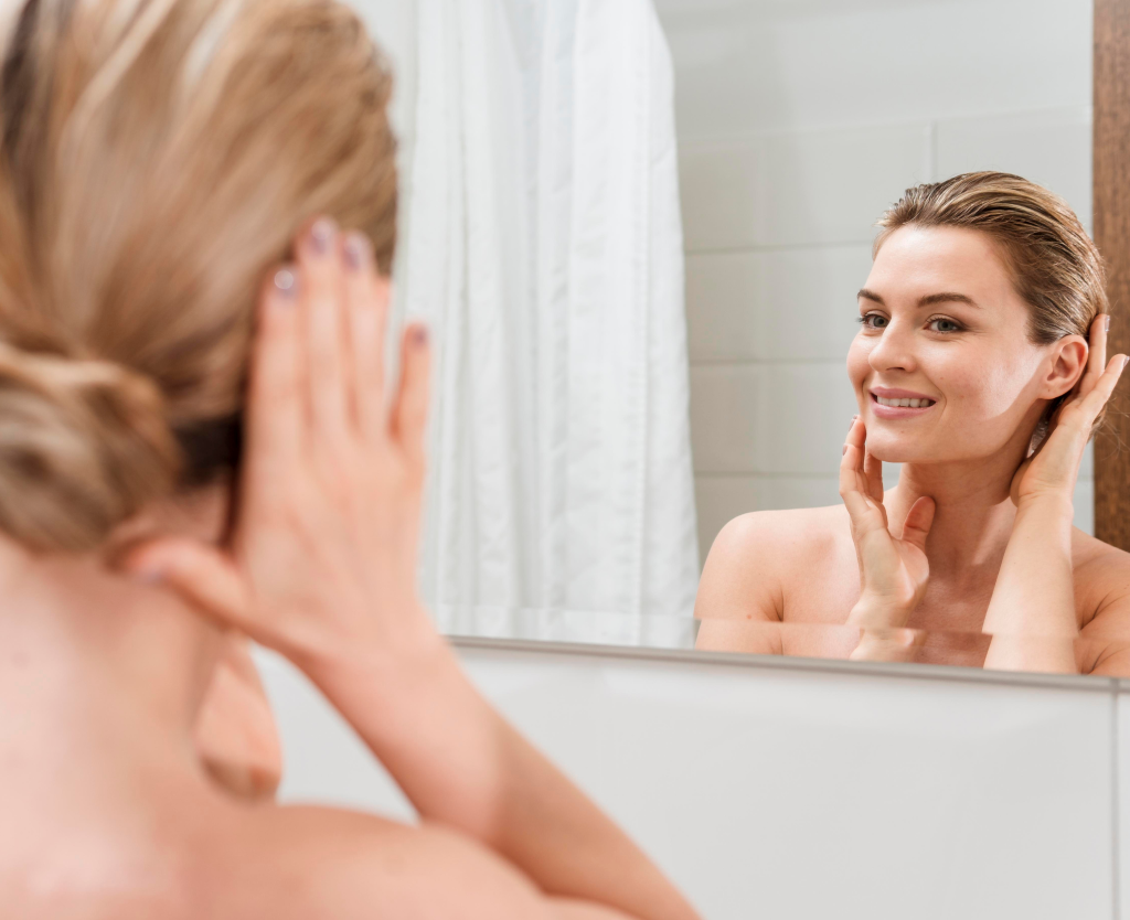 Woman Looking At Face In Mirror