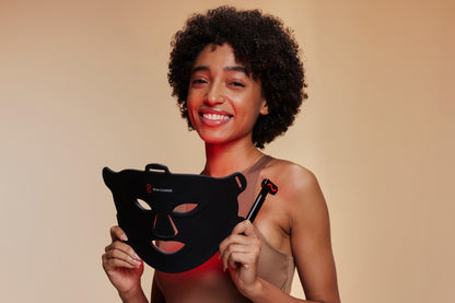 Woman Holding Red Light Face Mask