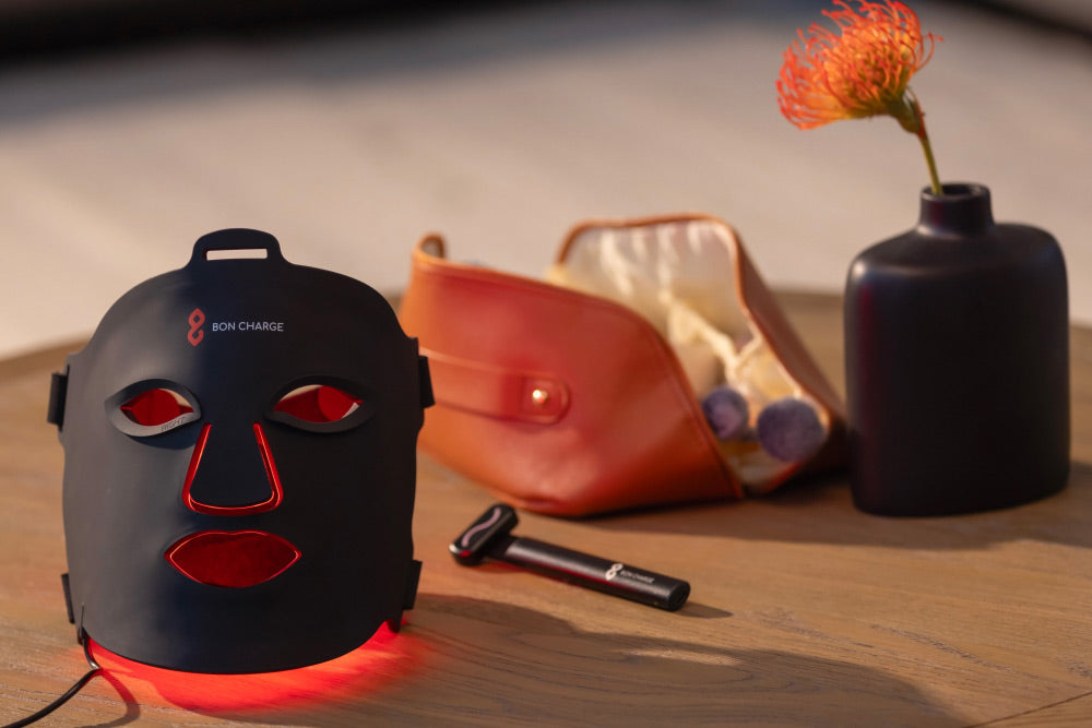 Red Light Face Mask and Red Light Face Wand on Table